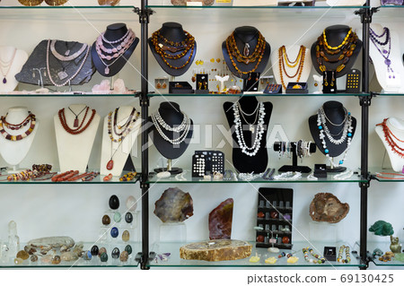 Gemstone jewellery on shelves of jewelry boutique 69130425