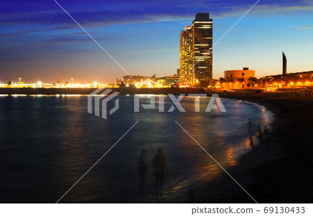 Barceloneta beach with skyscrapers in sunset Barceloneta beach with skyscrapers in sunset 69130433