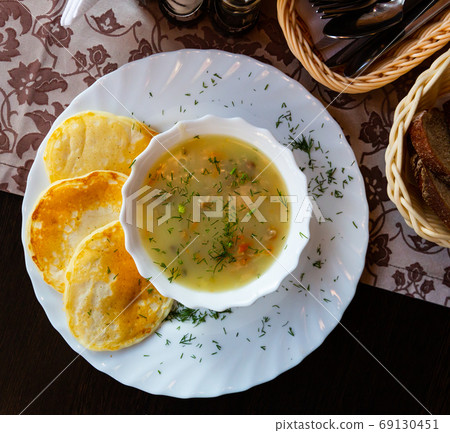 Traditional Belarusian machanka with pancakes 69130451
