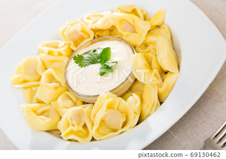 Ravioli with creamy sauce Ravioli with creamy sauce 69130462