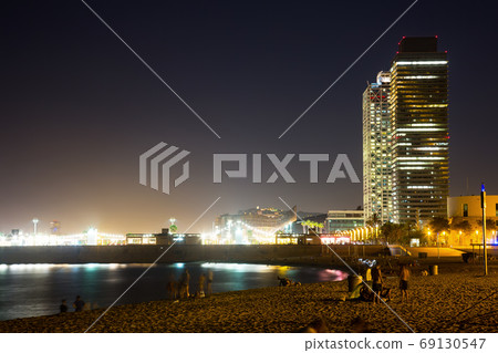 Illuminated Barceloneta Beach in summer night Illuminated Barceloneta Beach in summer night 69130547