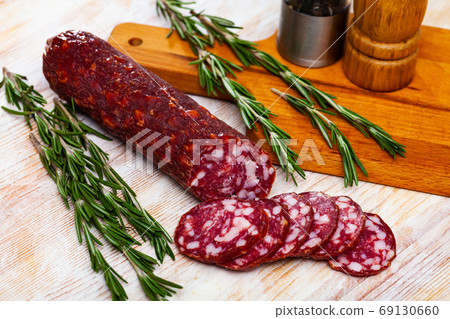 Tasty dried semi-dry sausage Braunschweig with rosemary Tasty dried semi-dry sausage Braunschweig with rosemary 69130660