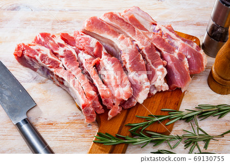 Raw pork ribs on wooden table Raw pork ribs on wooden table 69130755