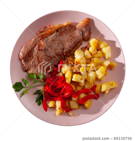 Beef entrecote with fried potato and baked sweet pepper Beef entrecote with fried potato and baked sweet pepper 69130756