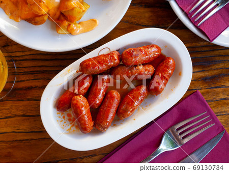 Spanish appetizer, mini chorizo de Navarra 69130784