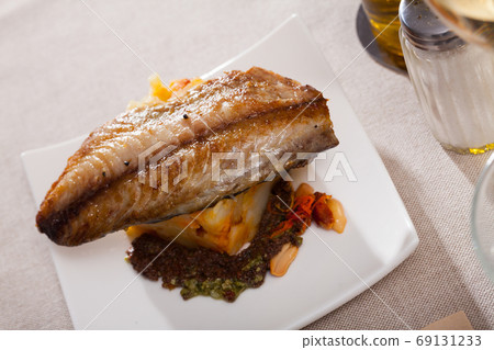 Fried scomber with potatoes Fried scomber with potatoes 69131233