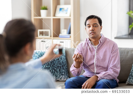 man and psychologist at psychotherapy session man and psychologist at psychotherapy session 69133033
