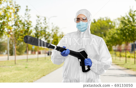 sanitation worker in hazmat with pressure washer sanitation worker in hazmat with pressure washer 69133050