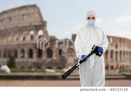 sanitation worker in hazmat with pressure washer sanitation worker in hazmat with pressure washer 69133116