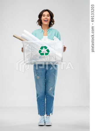 happy smiling young woman sorting paper waste 69133203