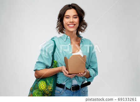 happy woman with food in reusable net bag and wok happy woman with food in reusable net bag and wok 69133261