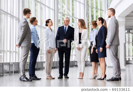 business people talking at office building business people talking at office building 69133611