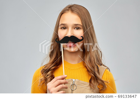 teenage girl with black moustaches party accessory teenage girl with black moustaches party accessory 69133647