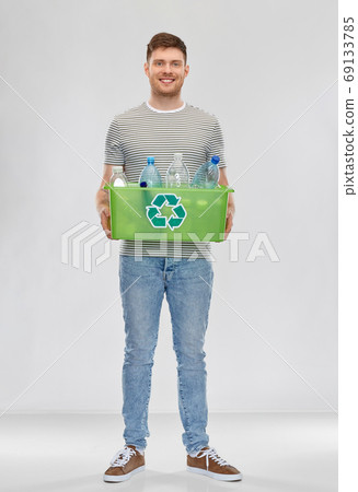 smiling young man sorting plastic waste smiling young man sorting plastic waste 69133785
