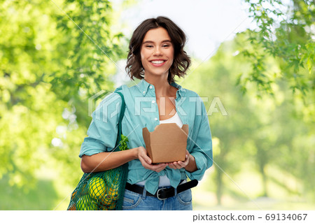 happy woman with food in reusable net bag and wok happy woman with food in reusable net bag and wok 69134067