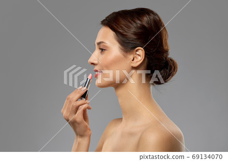 beautiful smiling young woman with pink lipstick 69134070