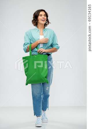 woman with reusable canvas bag for food shopping woman with reusable canvas bag for food shopping 69134165