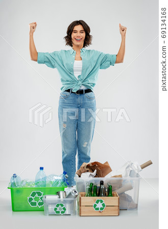 happy woman sorting paper, metal and plastic waste happy woman sorting paper, metal and plastic waste 69134168