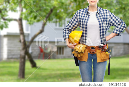 woman or builder with helmet and working tools woman or builder with helmet and working tools 69134228