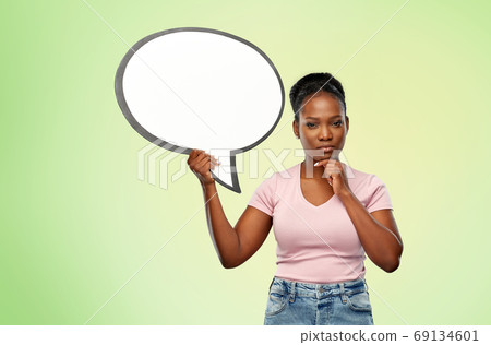 african american woman holding speech bubble 69134601