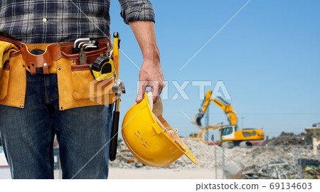 worker or builder with helmet and working tools worker or builder with helmet and working tools 69134603