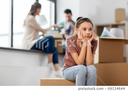 sad girl moving to new home with her family sad girl moving to new home with her family 69134644
