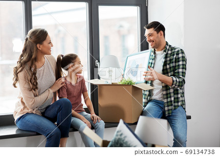 happy family with child moving to new home happy family with child moving to new home 69134738
