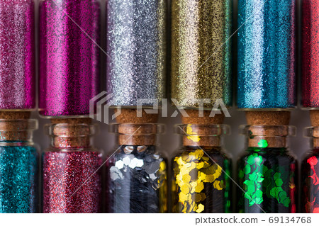 set of different glitters in small glass bottles set of different glitters in small glass bottles 69134768