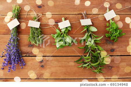 greens, spices or medicinal herbs on wood greens, spices or medicinal herbs on wood 69134948