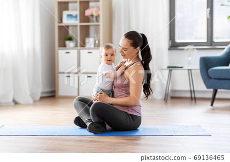 happy mother with little baby at home happy mother with little baby at home 69136465