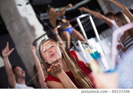 Adult woman dancing in the night club Adult woman dancing in the night club 69137206