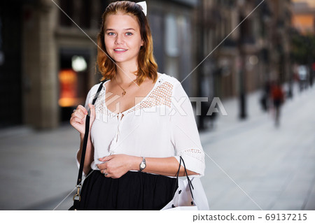 positive female in the modern city center positive female in the modern city center 69137215