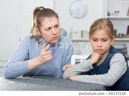 Mother lecturing her teenage daughter Mother lecturing her teenage daughter 69137236