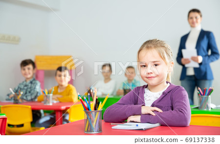 Assiduous schoolgirl at lesson 69137338