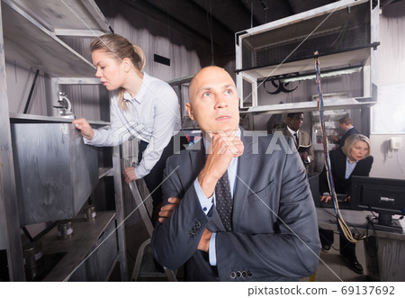Confused man in escape room 69137692