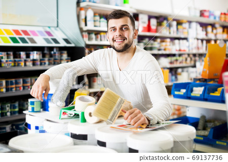 Male customer purchasing tools for house improvements Male customer purchasing tools for house improvements 69137736
