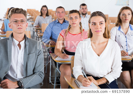 Group of people in lecture hall 69137890