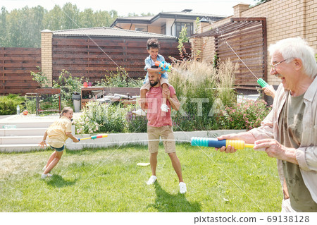 Having Fun With Water Guns Having Fun With Water Guns 69138128