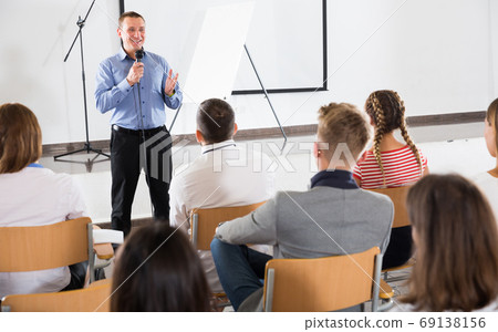 Male coach giving presentation Male coach giving presentation 69138156