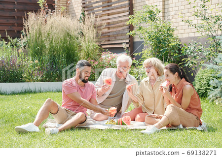 Parents And Children Having Picnic 69138271