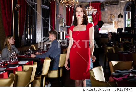 Woman in elegant red dress Woman in elegant red dress 69138474