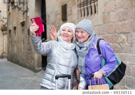 Senior females travelers taking selfie Senior females travelers taking selfie 69138511