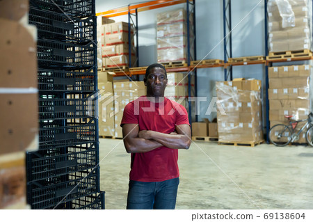 Portrait of afro man worker in warehouse Portrait of afro man worker in warehouse 69138604