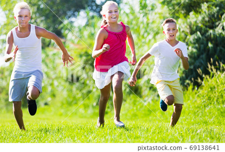 Kids playing active games Kids playing active games 69138641