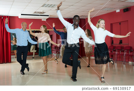 People learning tap dance movements 69138917