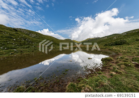 Monte Baldo - Green Meadows and small pond - Ridge of Naole Monte Baldo - Green Meadows and small pond - Ridge of Naole 69139151