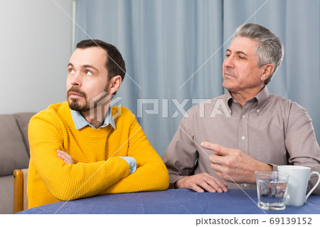 Mature father and son serious talk Mature father and son serious talk 69139152