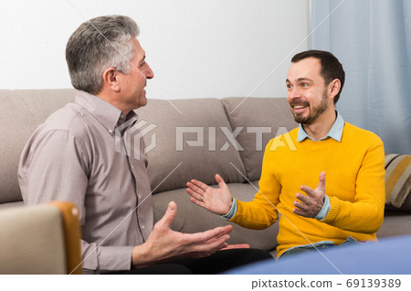 Adult father and son friendly conversation 69139389