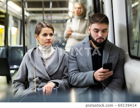 Couple traveling by city tram 69139414