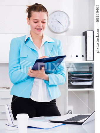 Businesswoman is signing contract Businesswoman is signing contract 69139462